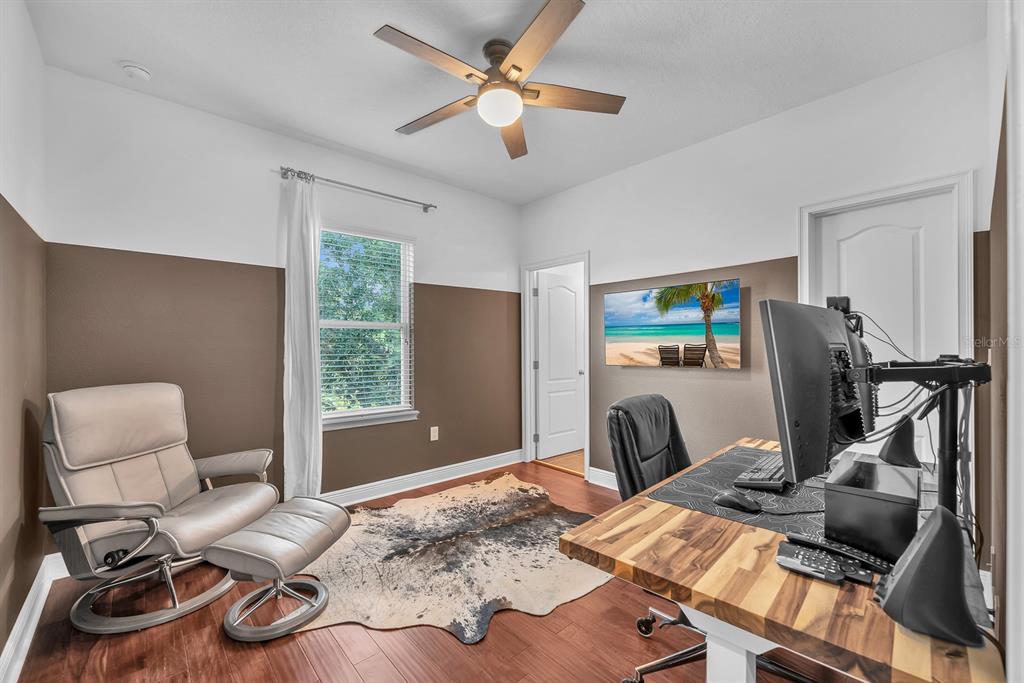 5310 Fishhawk Ridge Drive Lithia, FL 33547 - Photo 32 of 52 a bedroom with furniture and a window