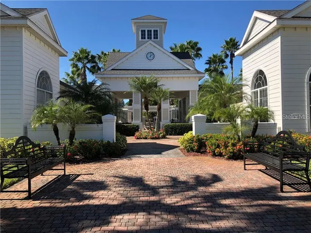 a view of a house with swimming pool and sitting area