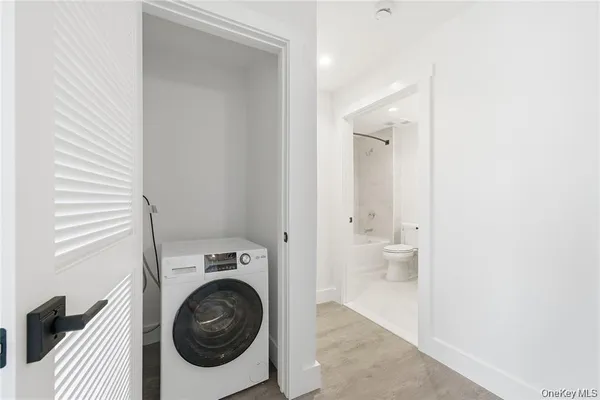 a view of bathroom with a washer and dryer
