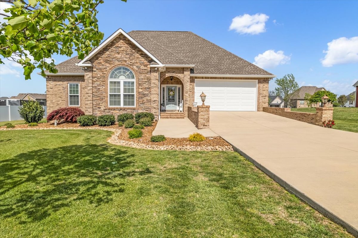 a front view of a house with garden