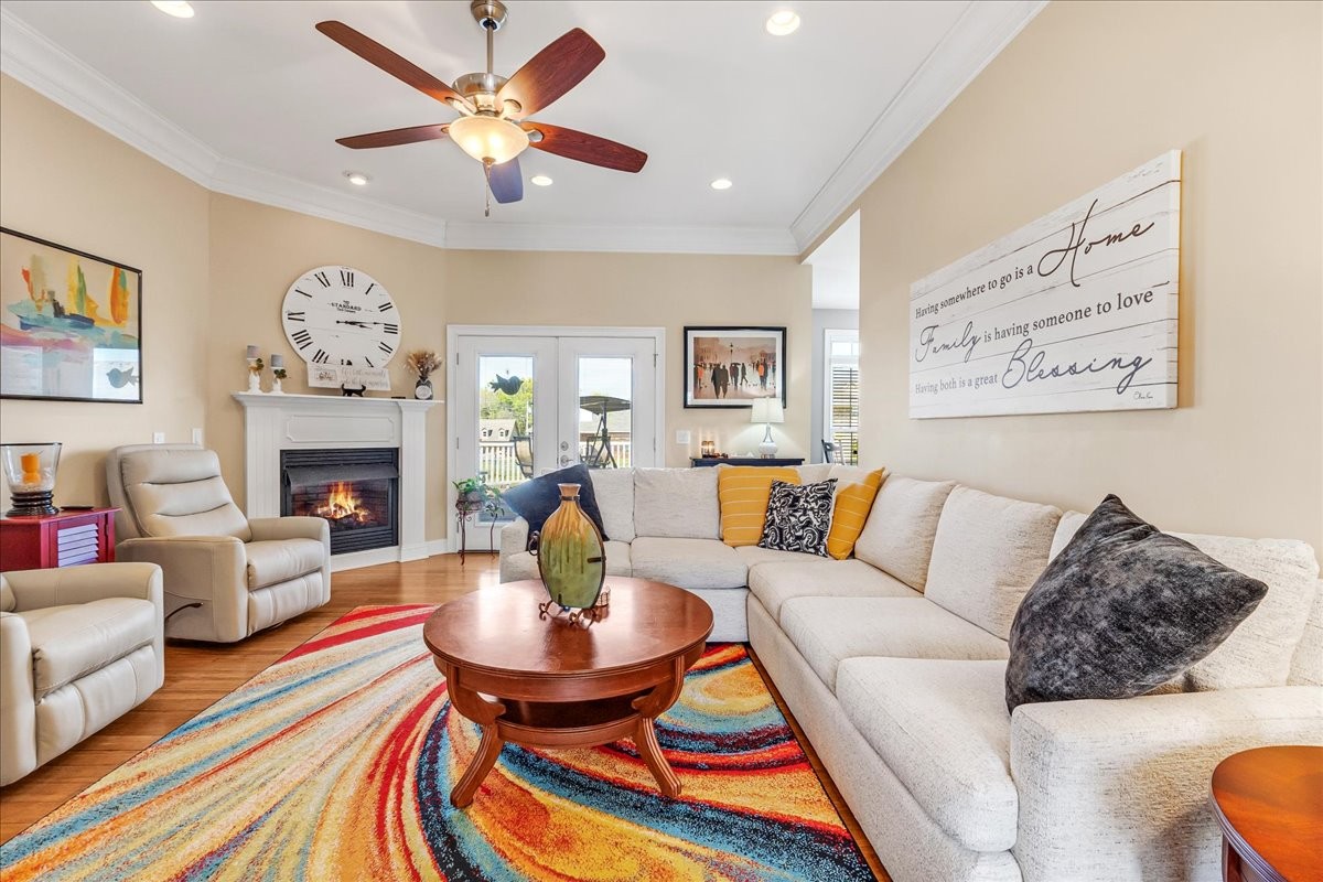 190 Stonegate Drive Smithville, TN 37166 - Photo 14 of 71 a living room with furniture a fireplace and a chandelier