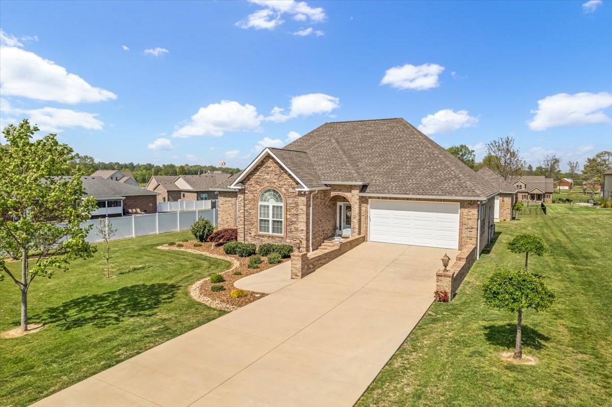 190 Stonegate Drive Smithville, TN 37166 - Photo 2 of 71 a view of a house with a yard and potted plants