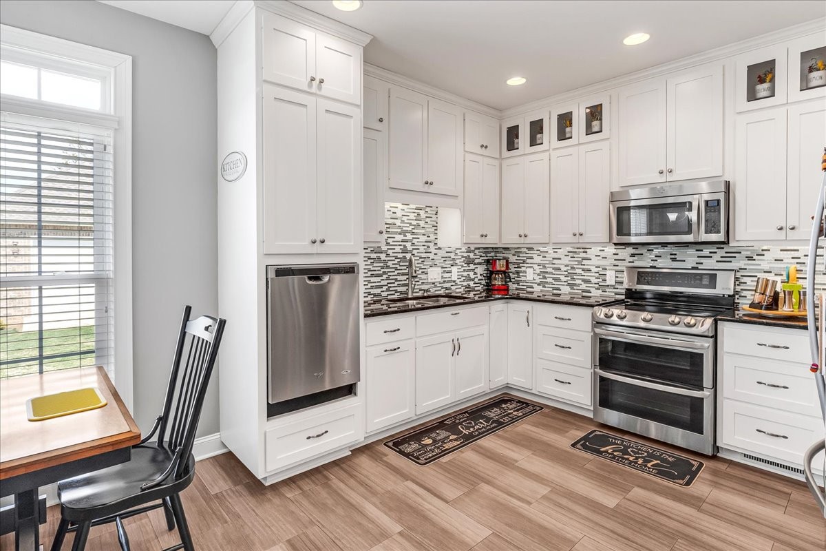 190 Stonegate Drive Smithville, TN 37166 - Photo 21 of 71 a kitchen with stainless steel appliances a stove sink and microwave