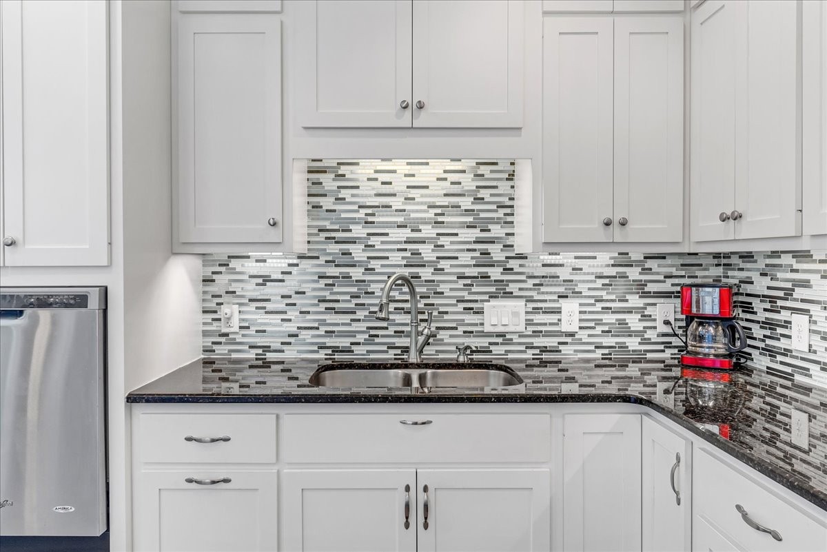 190 Stonegate Drive Smithville, TN 37166 - Photo 22 of 71 a kitchen with white cabinets and a sink