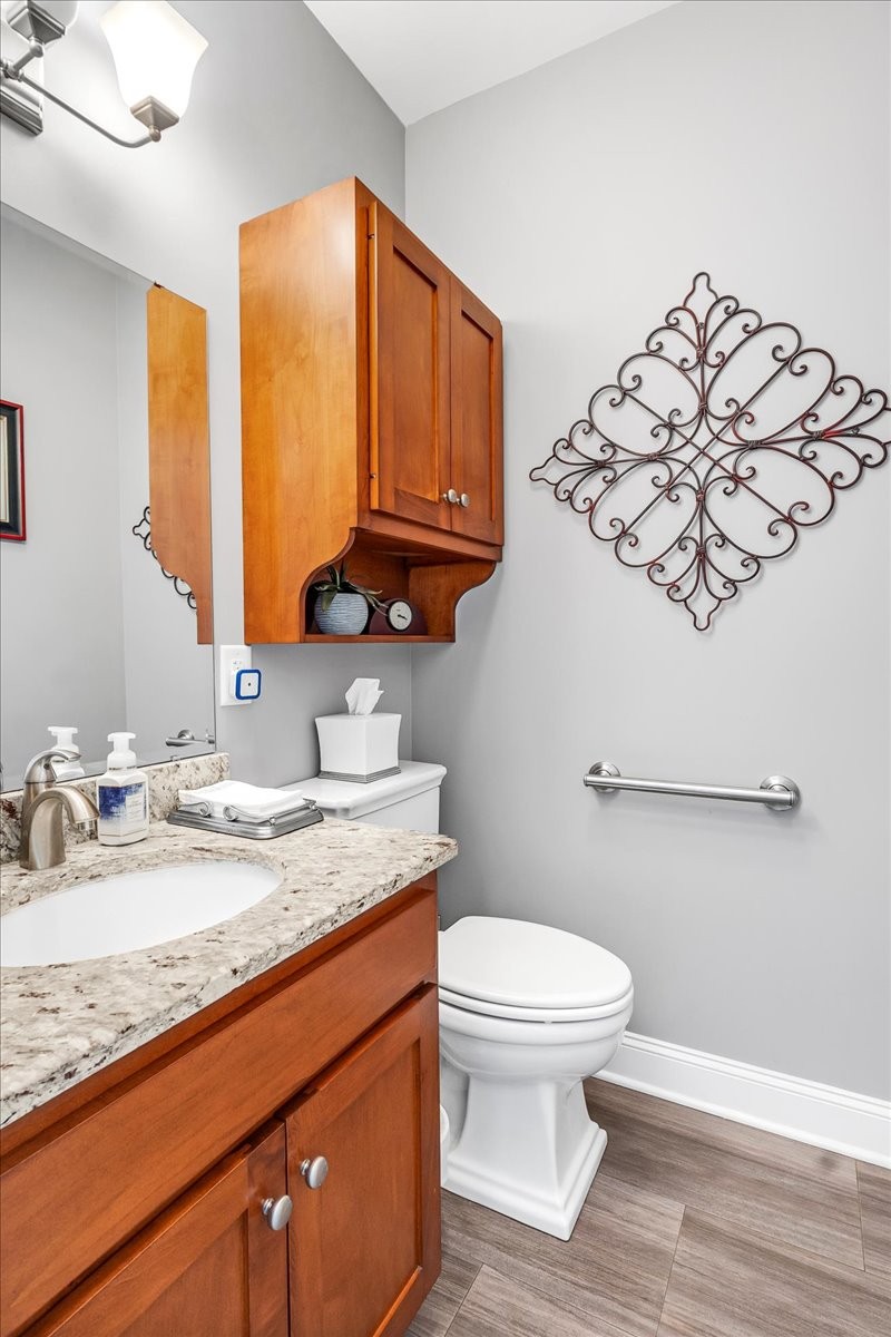 190 Stonegate Drive Smithville, TN 37166 - Photo 28 of 71 a bathroom with a granite countertop sink a toilet and a mirror