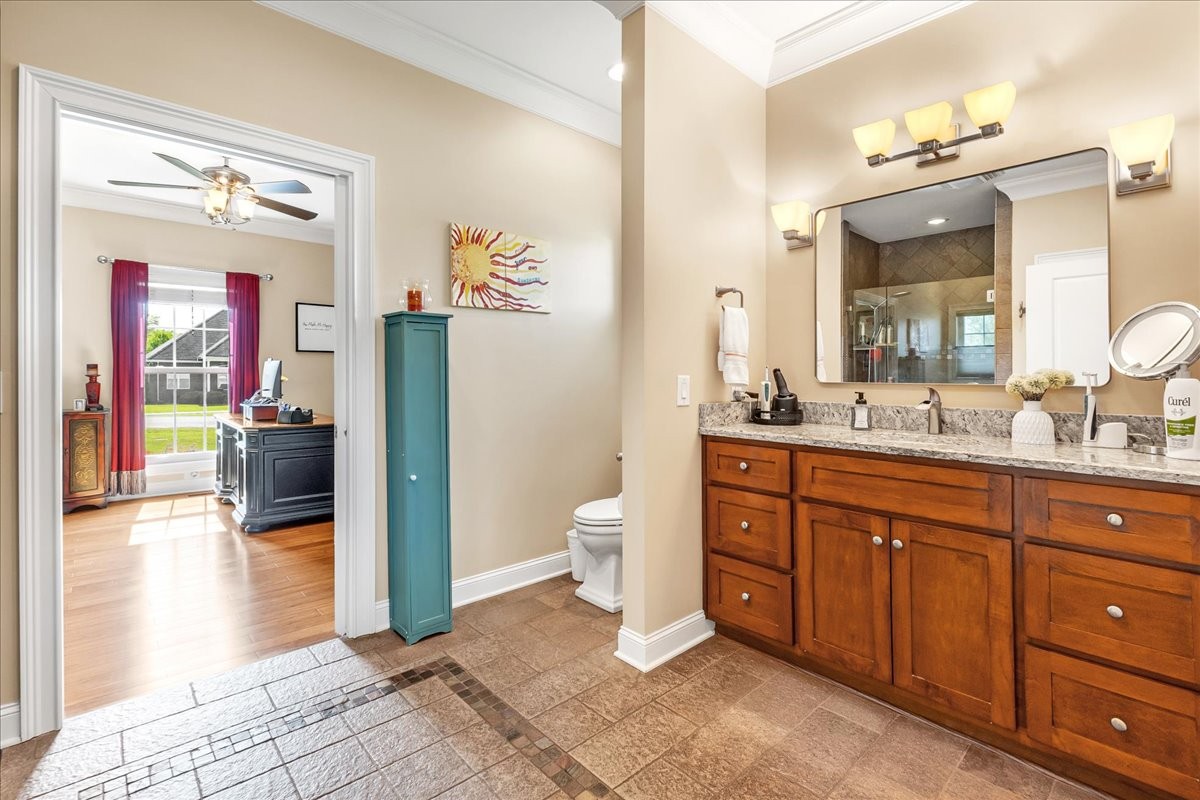 190 Stonegate Drive Smithville, TN 37166 - Photo 38 of 71 a spacious bathroom with a granite countertop sink and a mirror