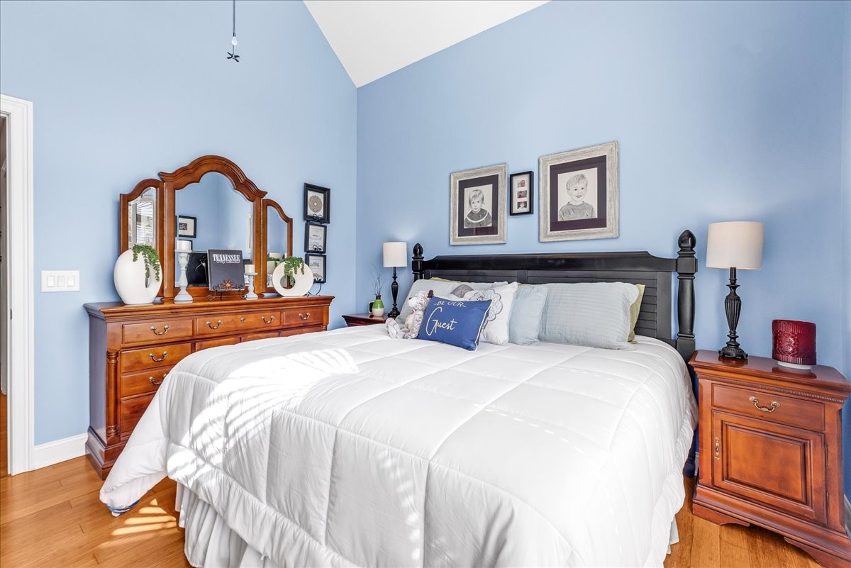 190 Stonegate Drive Smithville, TN 37166 - Photo 48 of 71 a bedroom with a bed and a lamp on dresser