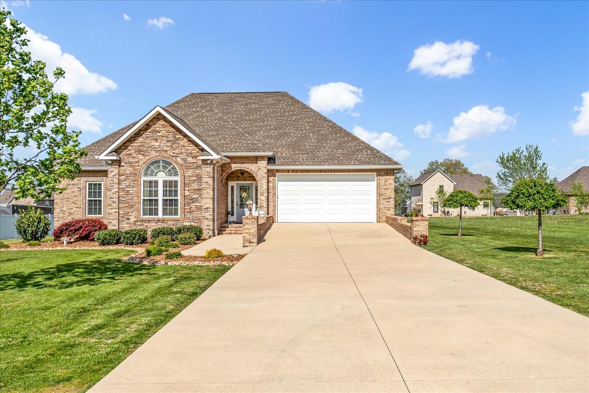 190 Stonegate Drive Smithville, TN 37166 - Photo 5 of 71 a front view of a house with a yard and garage