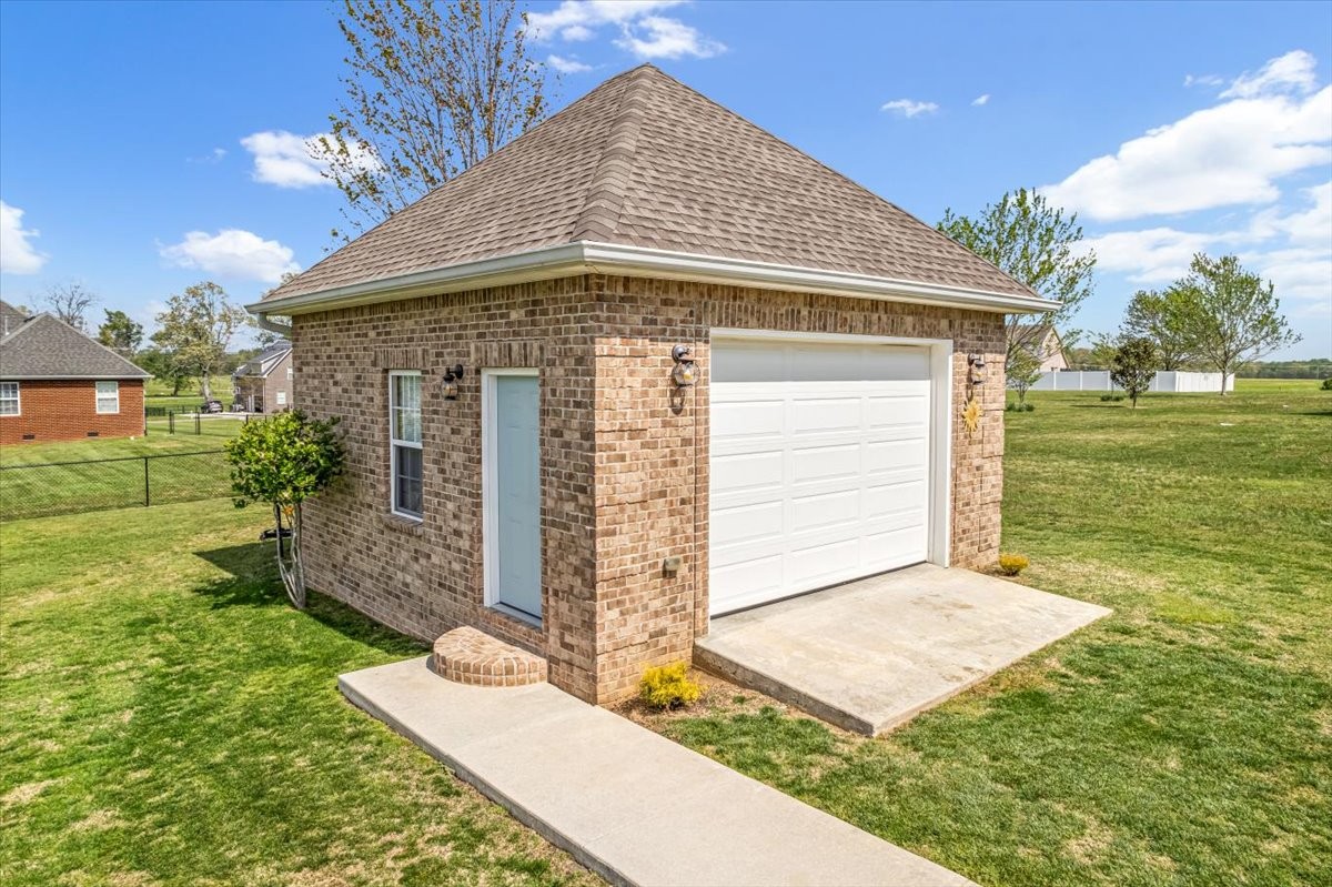 190 Stonegate Drive Smithville, TN 37166 - Photo 65 of 71 a front view of a house with garden