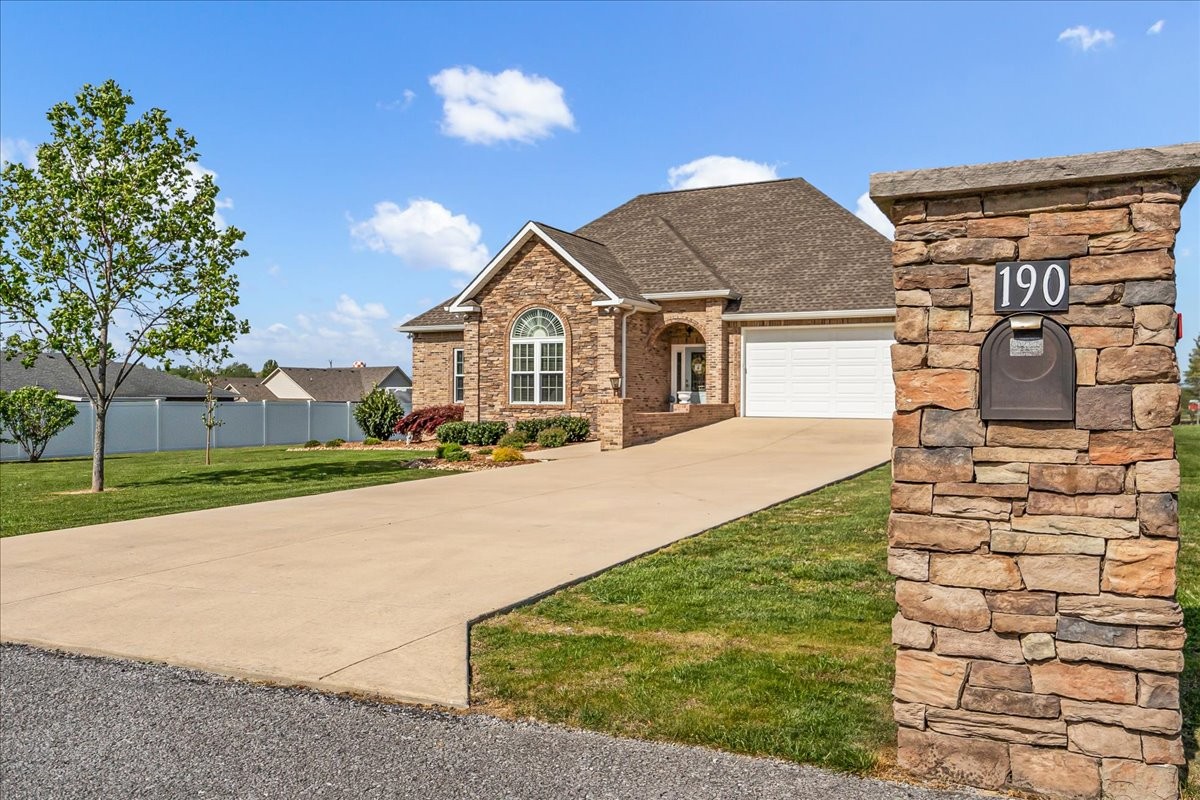 190 Stonegate Drive Smithville, TN 37166 - Photo 71 of 71 a front view of a house with a yard and garage