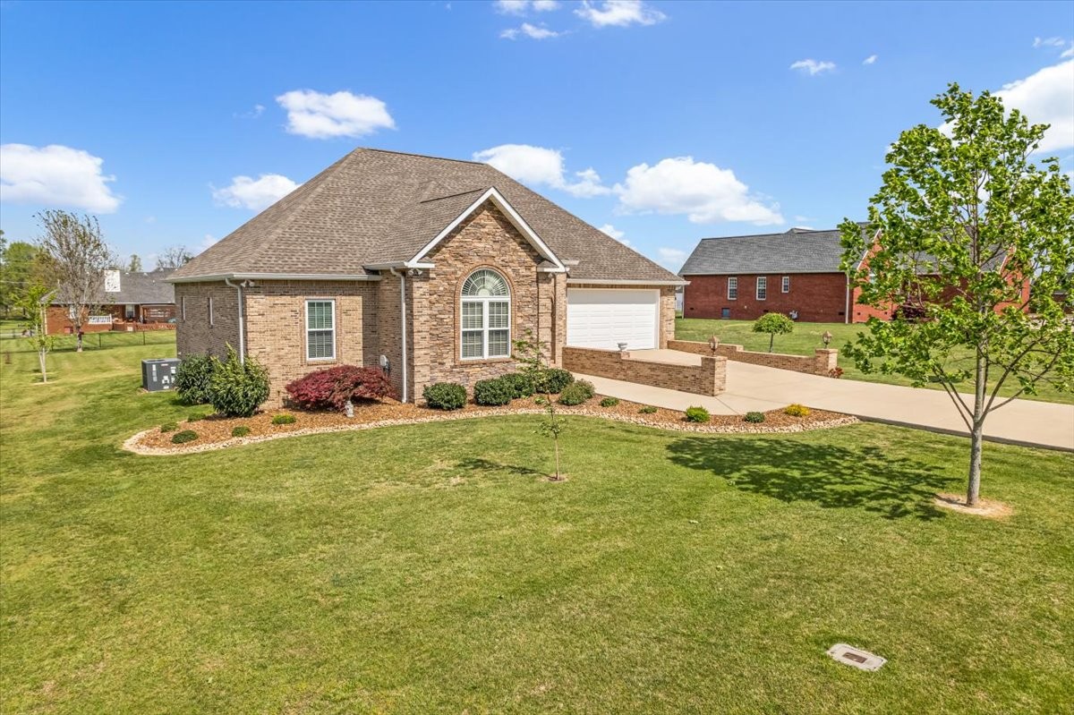 190 Stonegate Drive Smithville, TN 37166 - Photo 10 of 71 a view of a house with a swimming pool and a yard
