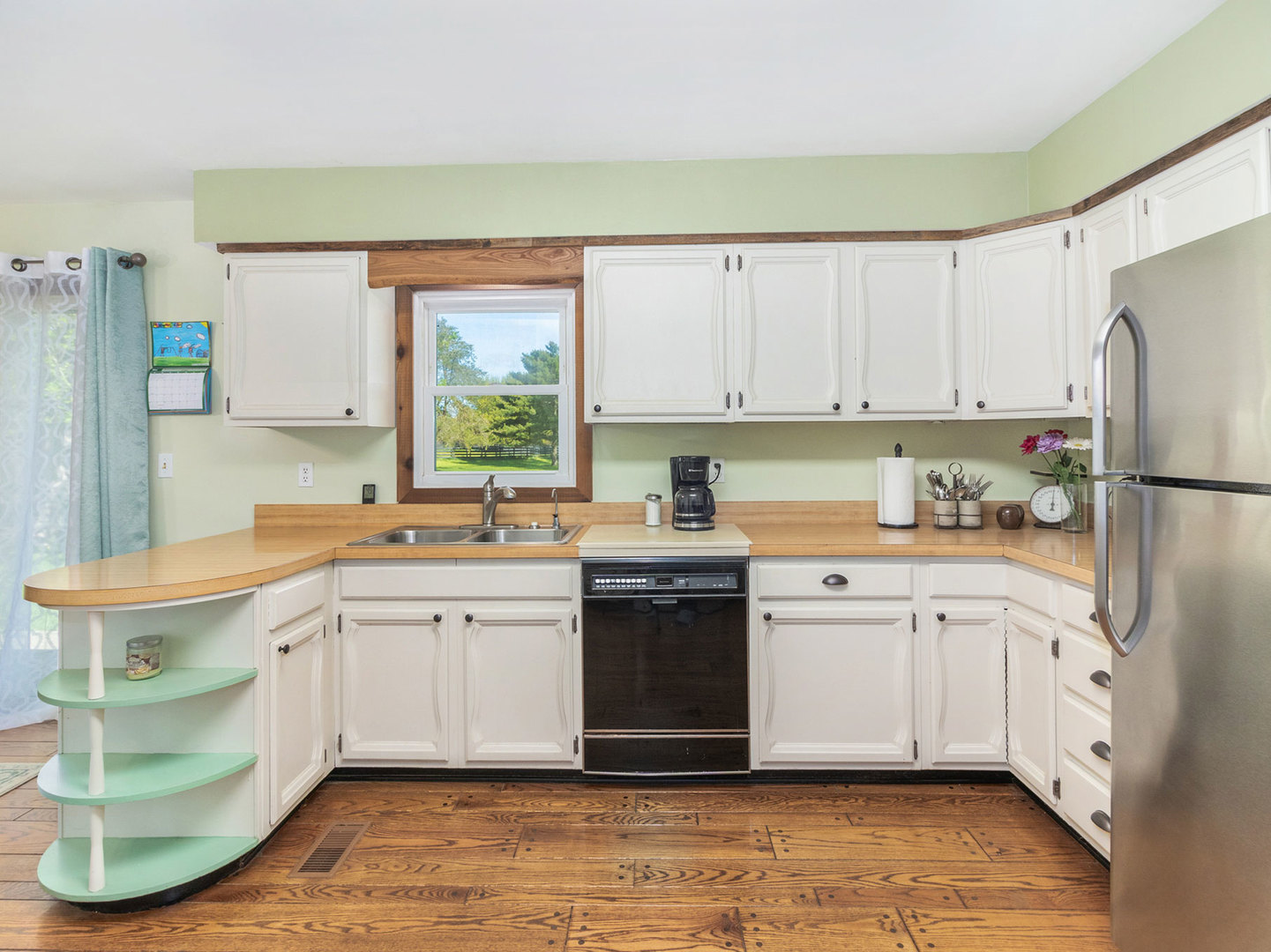 3017 Graham Road Somonauk, IL 60552 - Photo 12 of 30 a kitchen with stainless steel appliances granite countertop a stove a sink and a refrigerator