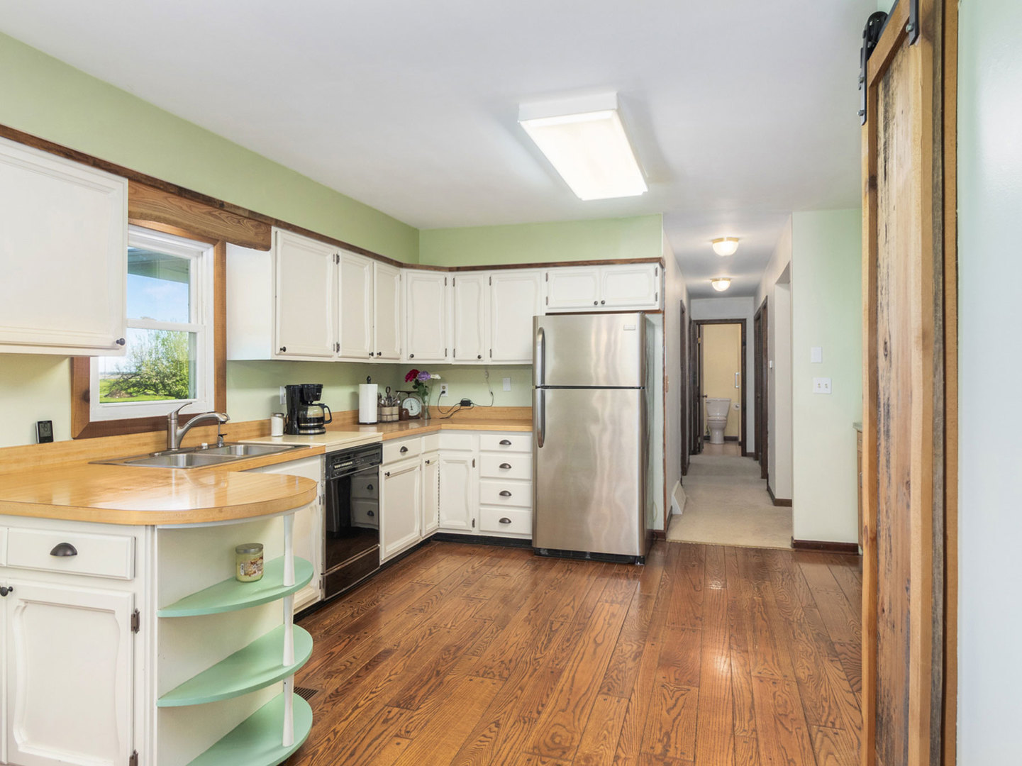 3017 Graham Road Somonauk, IL 60552 - Photo 9 of 30 a kitchen with a refrigerator a sink and dishwasher with wooden floor