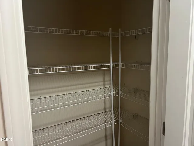 a view of a room with racks on the wall