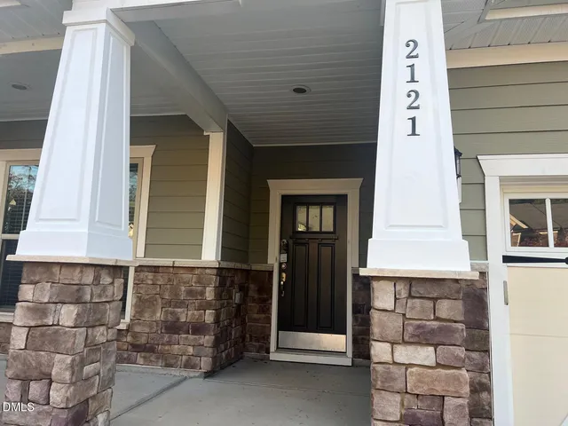 a front view of a house with a door