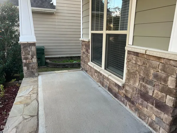 a view of house with window and wooden fence