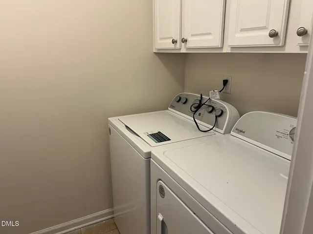a bathroom with a bathtub and next to a window
