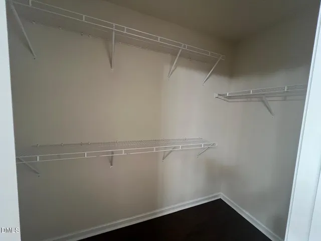 a view of an empty walk in closet