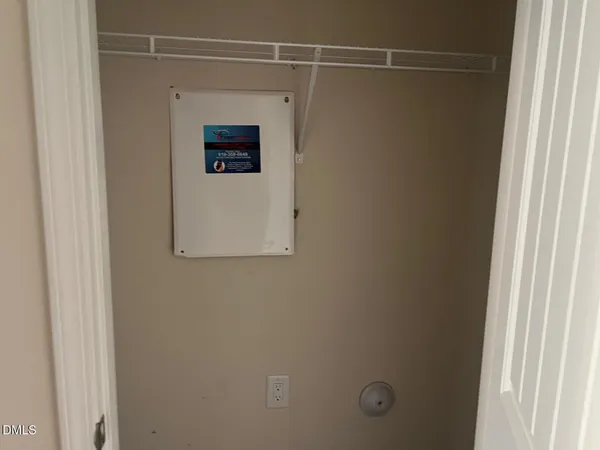 a bathroom with a shower and a window