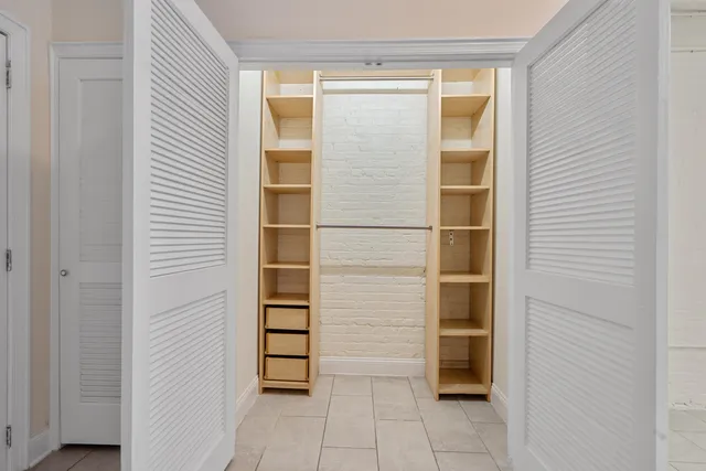 a bathroom with a bathtub and shower