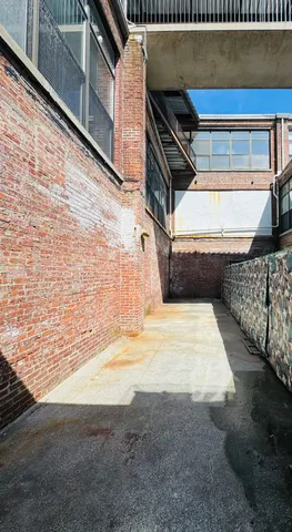 a view of a balcony with table and chairs