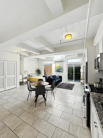 a view of a dining room with furniture window and outside view