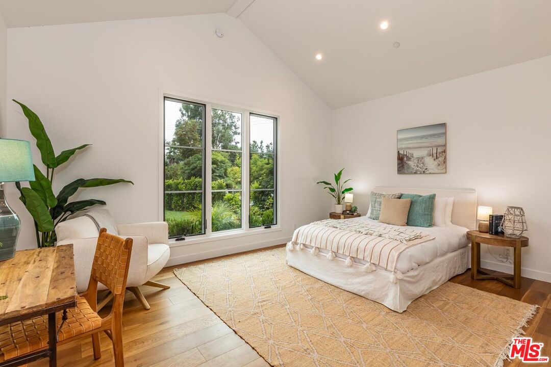 5916 Bonsall Drive Malibu, CA 90265 - Photo 13 of 20 a bedroom with a bed and a window