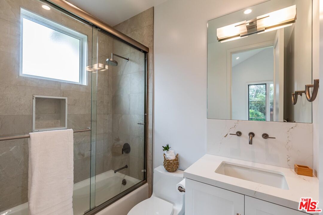 5916 Bonsall Drive Malibu, CA 90265 - Photo 14 of 20 a bathroom with a sink a toilet and shower