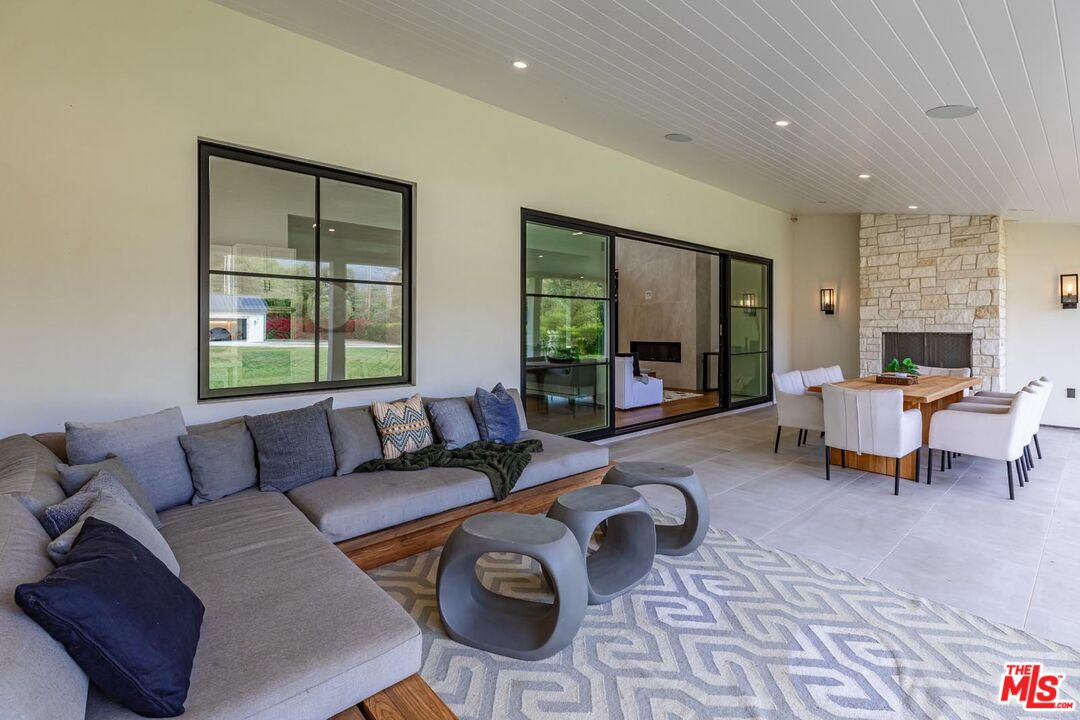 5916 Bonsall Drive Malibu, CA 90265 - Photo 16 of 20 a living room with furniture and a window