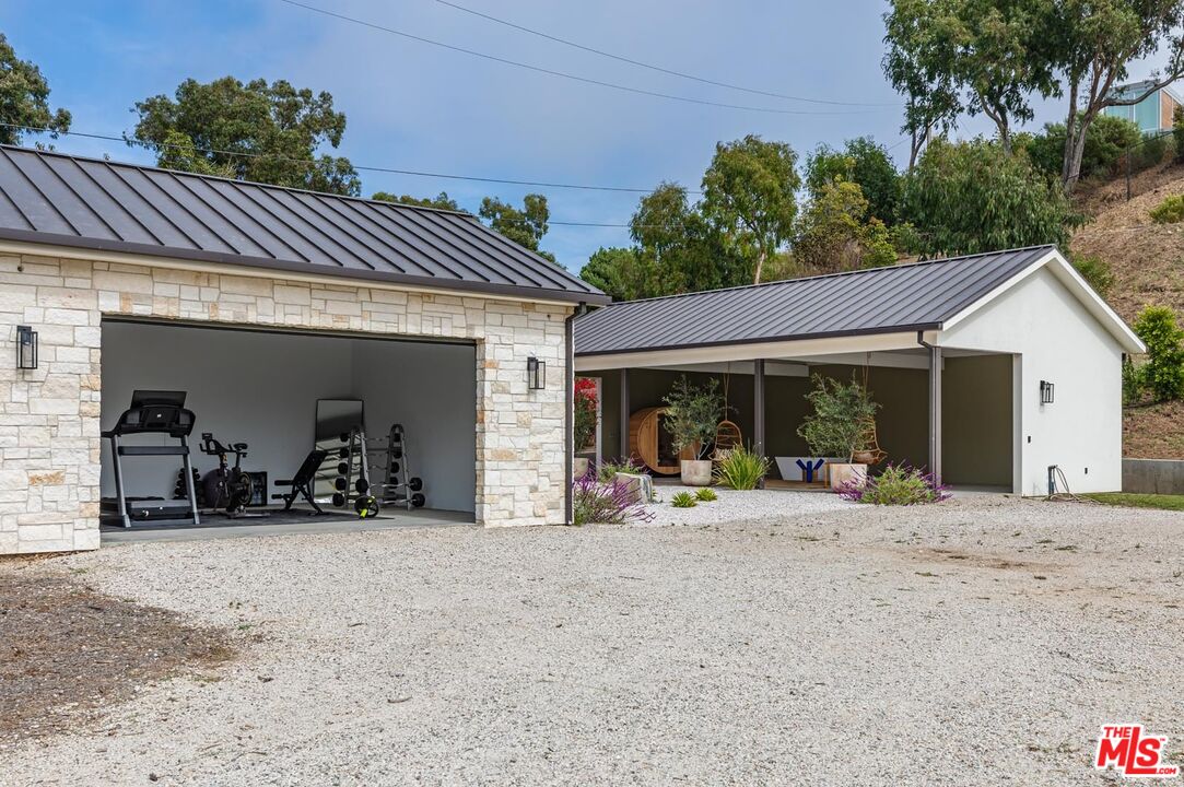 5916 Bonsall Drive Malibu, CA 90265 - Photo 18 of 20 a view of a house with a patio