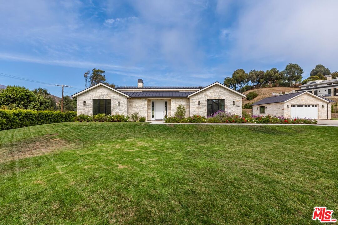 5916 Bonsall Drive Malibu, CA 90265 - Photo 3 of 20 a house view with a garden space