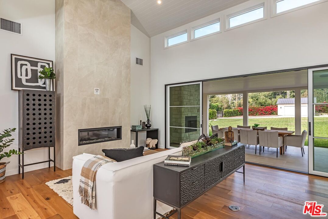 5916 Bonsall Drive Malibu, CA 90265 - Photo 4 of 20 a living room with furniture and a large window