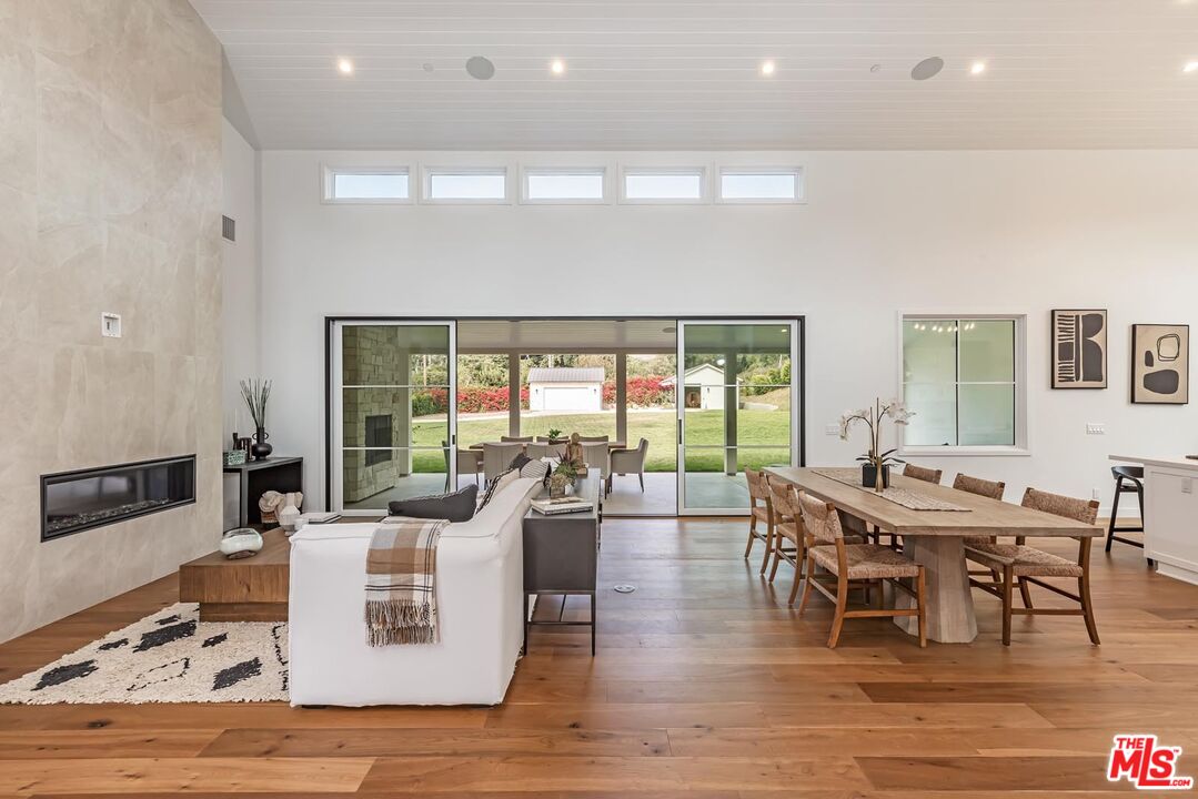 5916 Bonsall Drive Malibu, CA 90265 - Photo 5 of 20 a view of a dining room with furniture window and wooden floor