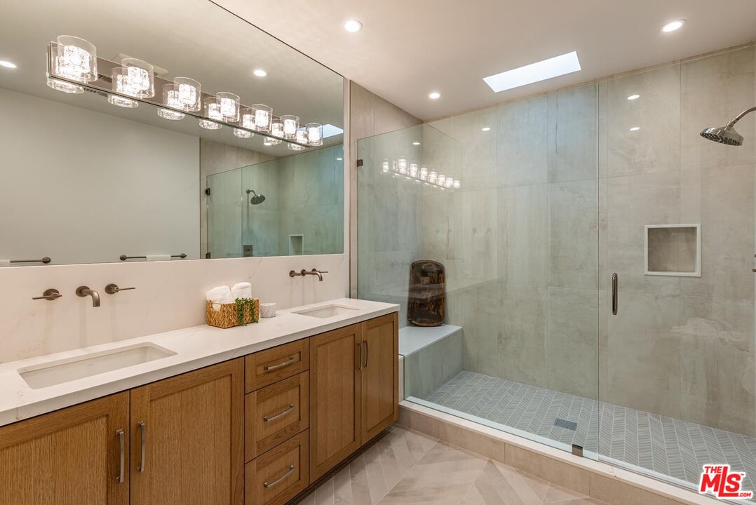 5916 Bonsall Drive Malibu, CA 90265 - Photo 9 of 20 a bathroom with a sink shower and a mirror