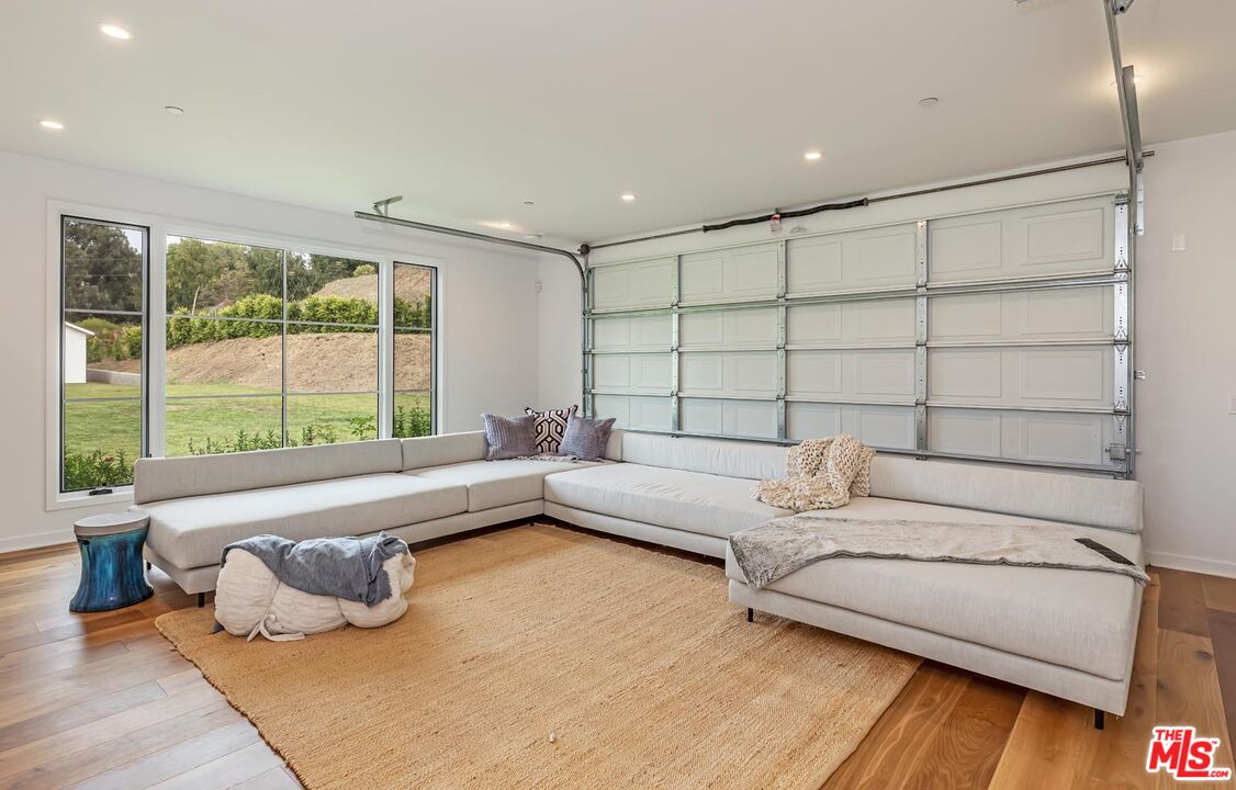 5916 Bonsall Drive Malibu, CA 90265 - Photo 10 of 20 a living room with furniture and a large window