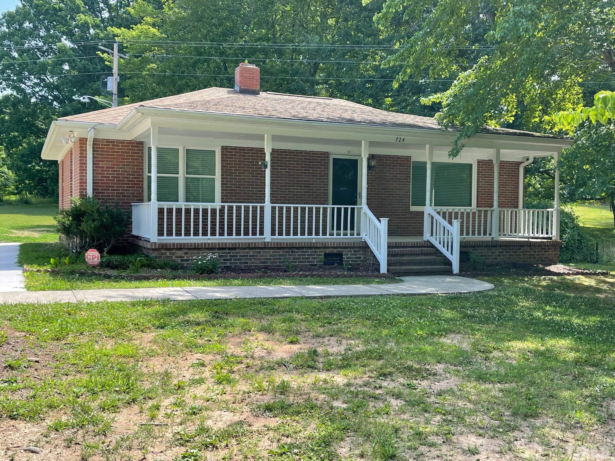724 Mason Road Durham, NC 27712 - Photo 2 of 18 a front view of a house with garden