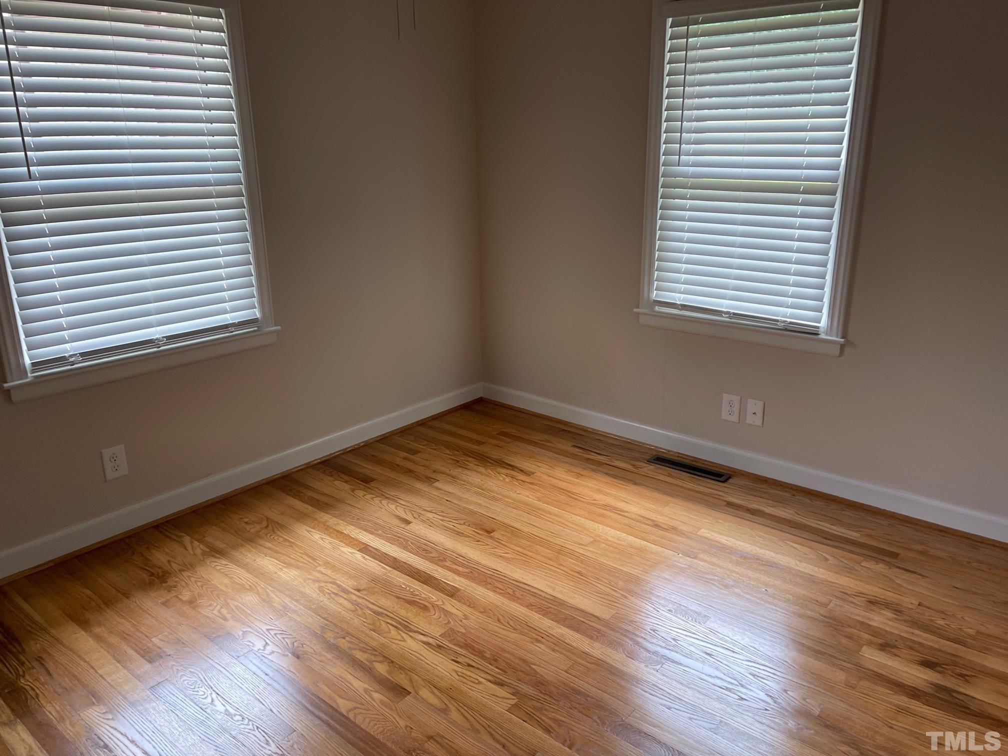 724 Mason Road Durham, NC 27712 - Photo 7 of 18 a view of a room with wooden floor and a window