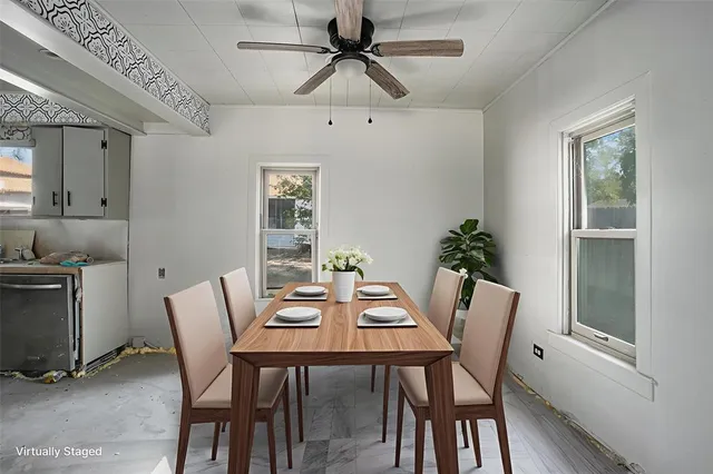 a view of a dining room with furniture and window