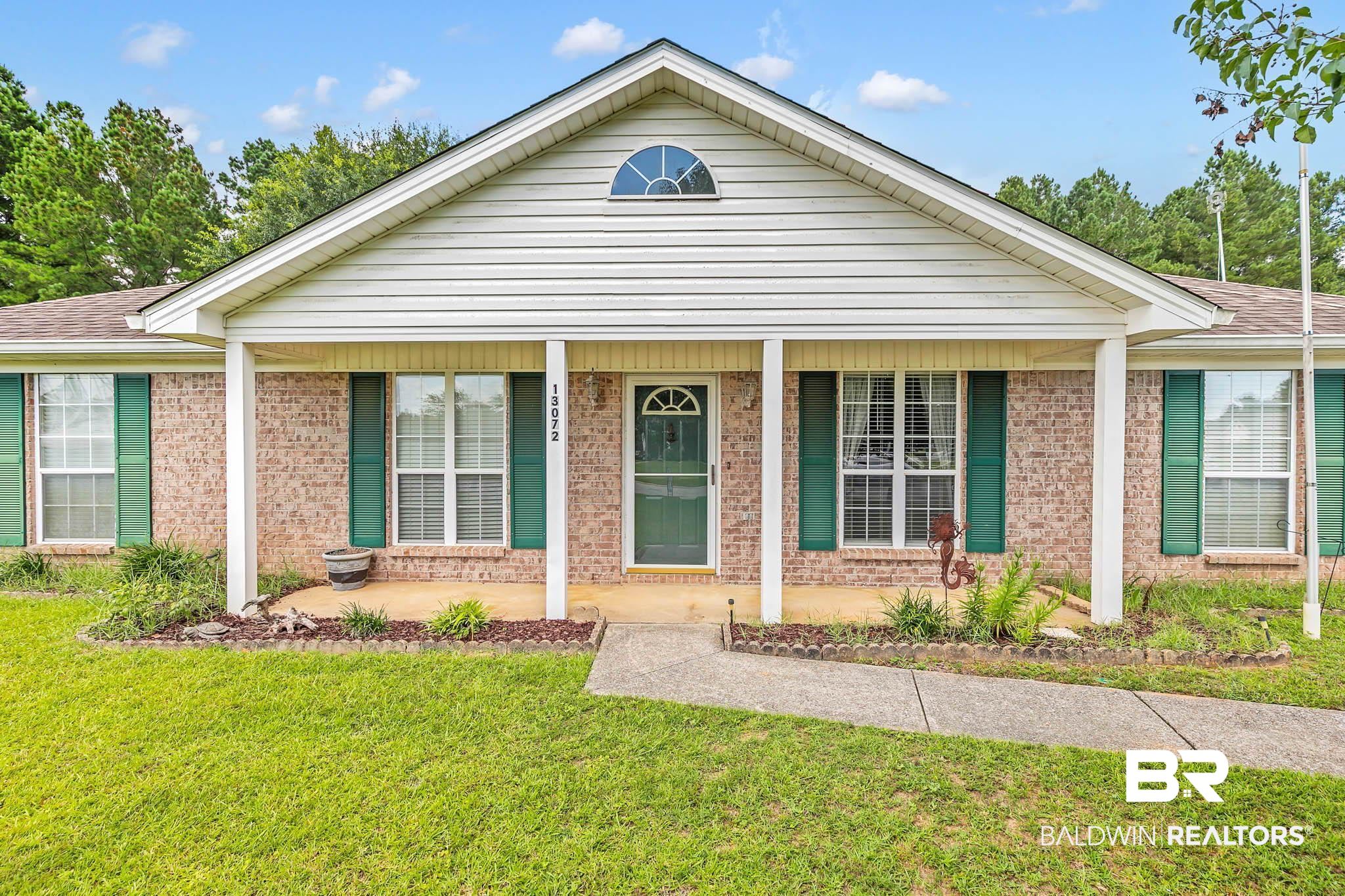 13072 Labradors Run Foley, AL 36535 - Photo 31 of 31 Ranch-style home with a porch, a front yard, brick siding, and roof with shingles