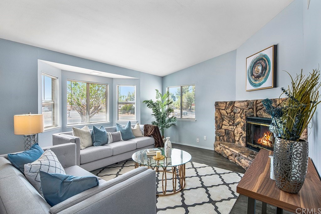 15595 Ramona Road Apple Valley, CA 92307 - Photo 1 of 1 a living room with furniture and a fireplace