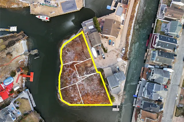 an aerial view of multi story residential apartment building with yard