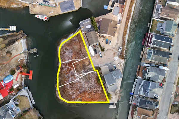 an aerial view of multi story residential apartment building with yard