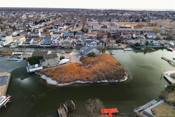 an aerial view of a house with a lake view