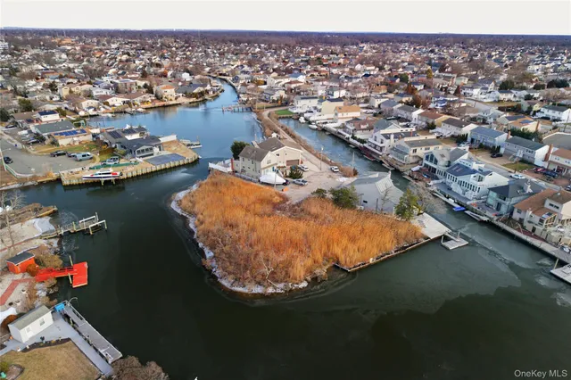 an aerial view of a house with a lake view