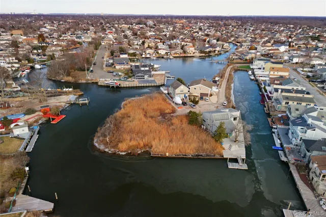 an aerial view of a house with a ocean view
