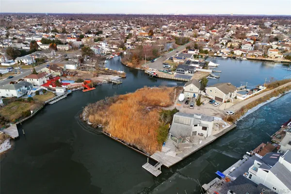 an aerial view of a house with a ocean view