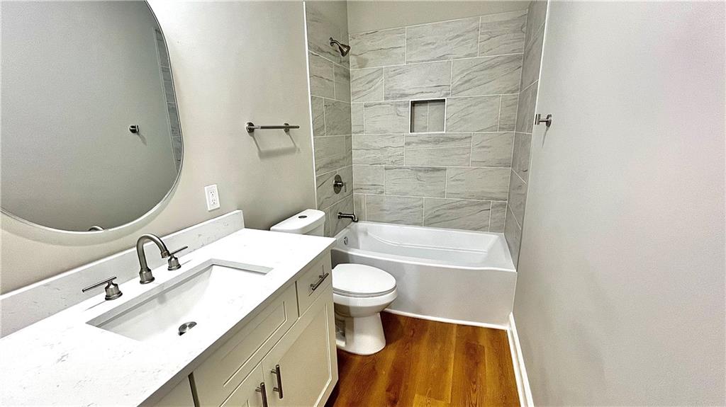 23 S Road Griffin, GA 30224 - Photo 28 of 32 a bathroom with a sink a toilet and shower