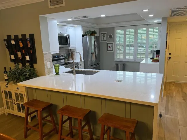 a dining table with chairs and window