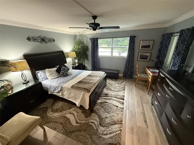 a bed sitting in a room next to a window