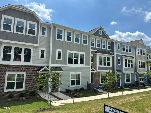 2913 Richardson Road, Unit 475 Apex, NC 27502 - Photo 20 of 24 a front view of a house with yard and green space